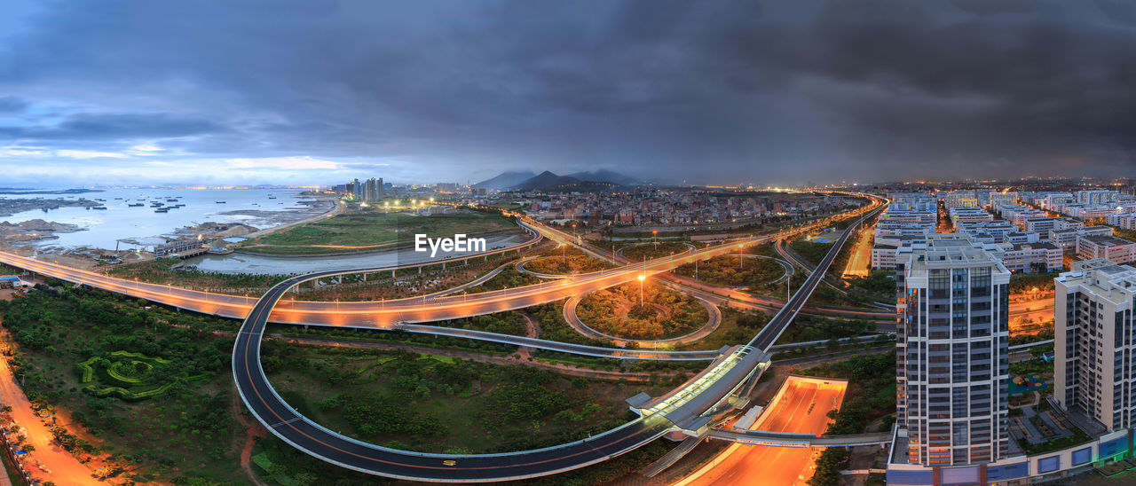 High angle view of illuminated cityscape against sky