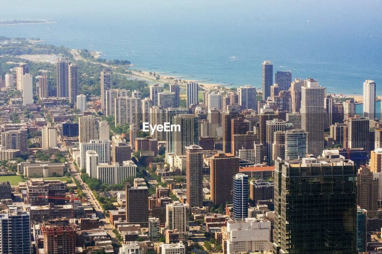 HIGH ANGLE VIEW OF MODERN BUILDINGS IN CITY