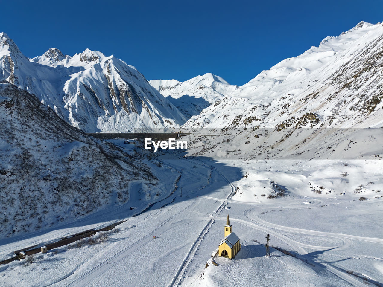 scenic view of snowcapped mountains against clear sky