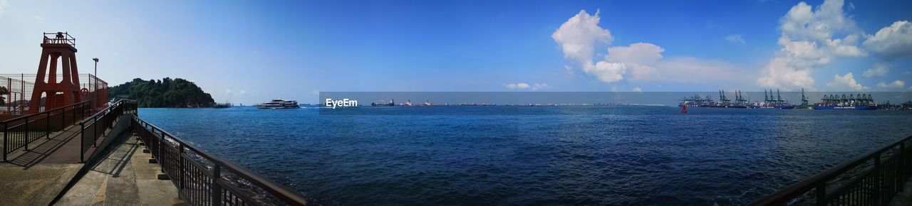 PANORAMIC SHOT OF SEA AGAINST BLUE SKY