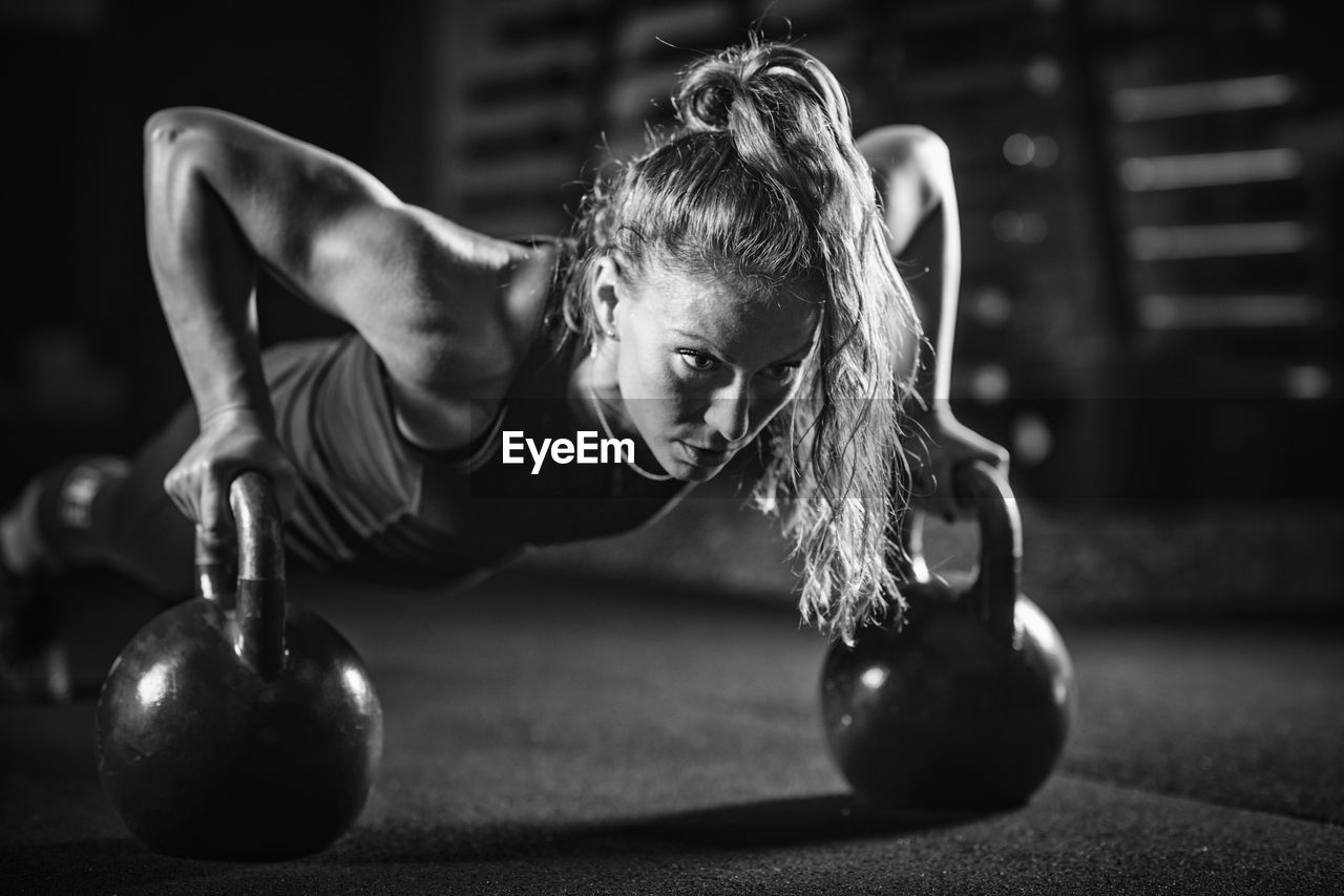 Young woman exercising at gym