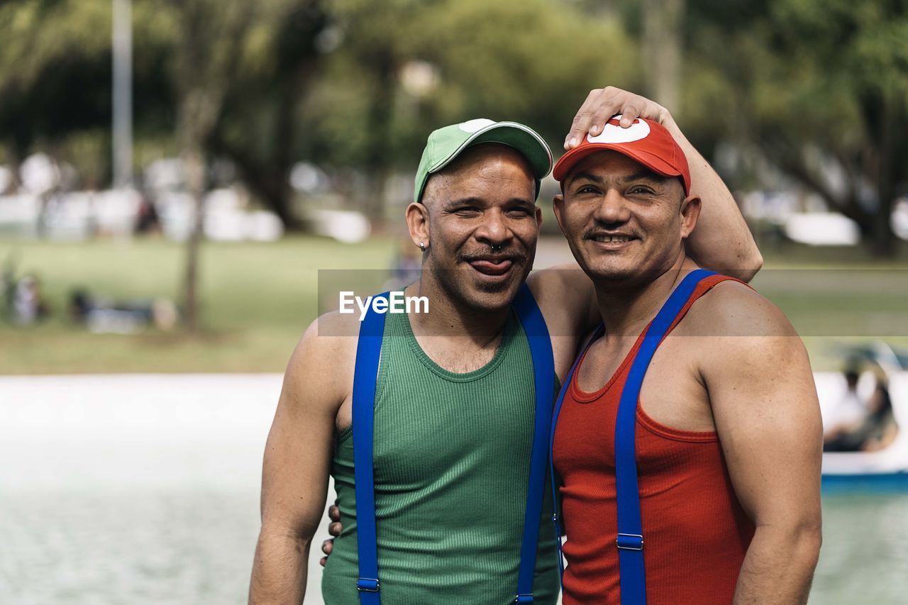 Portrait of smiling young boys standing on the day of latino gay pride in south america.