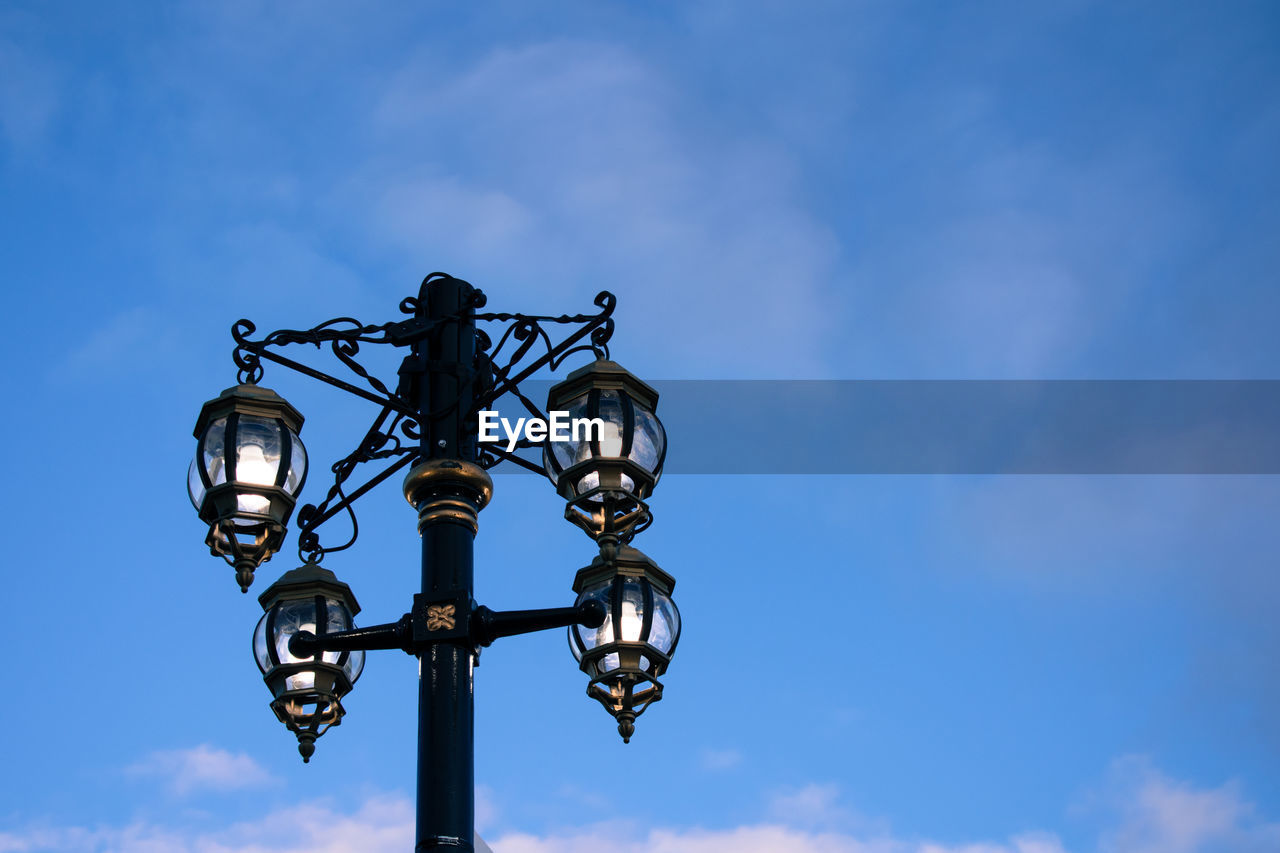 Low angle view of street light against sky