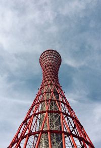 Low angle view of ferris wheel against cloudy sky