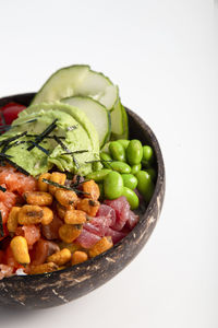 Traditional hawaiian tuna and salmon poke platter on white background with copy space