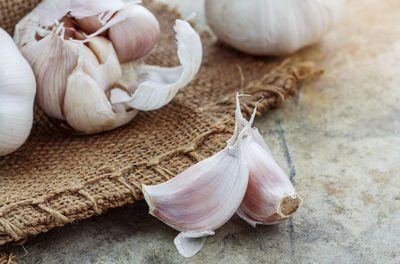 Close-up of white garlic on table