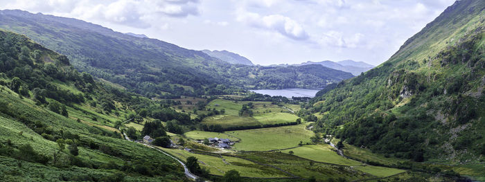 Scenic view of landscape and mountains against sky