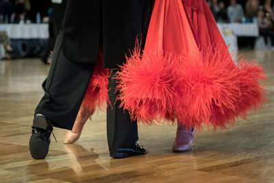 Low section of people dancing on floor