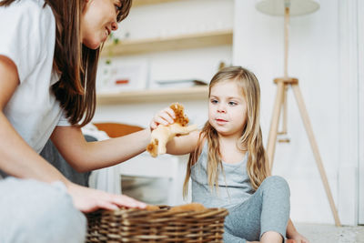 Mother and daughter in basket