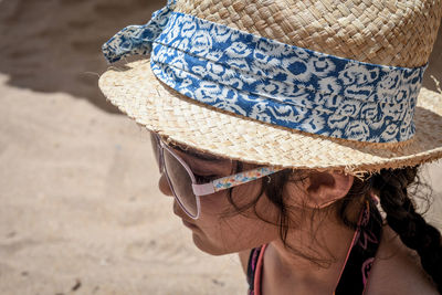 Girl wearing hat at beach