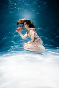 Woman swimming in pool