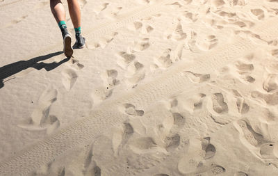 Low section of man on sand