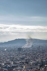 High angle view of city buildings against sky