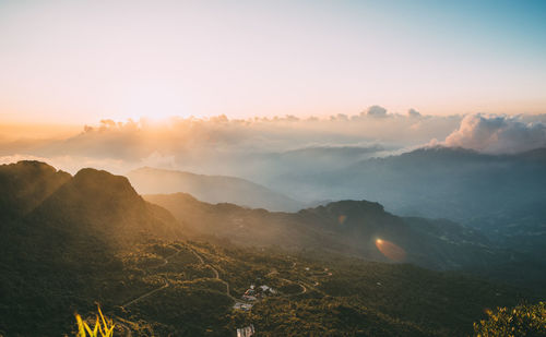 Scenic view of mountains against sky during sunset