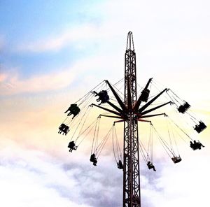Low angle view of ferris wheel against sky
