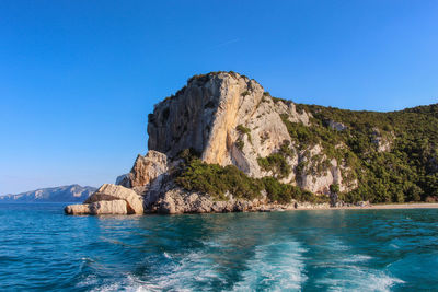 Scenic view of sea against clear blue sky