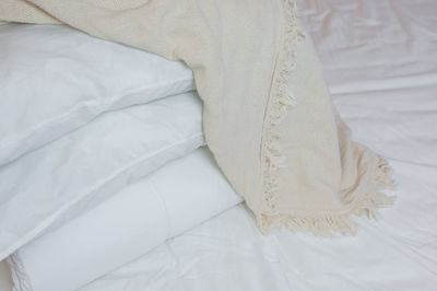 High angle view of white curtain on bed at home