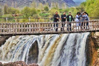 Scenic view of dam and bridge in river