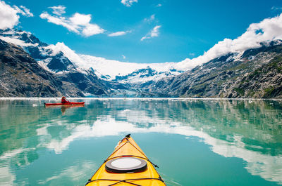 Scenic view of lake and mountains against sky