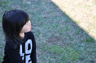 High angle view of girl standing on field