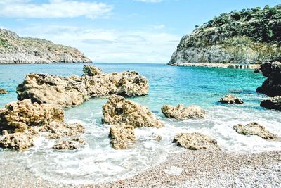 Scenic view of sea against blue sky