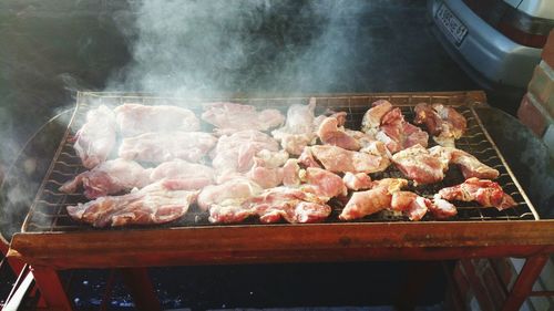 Close-up of meat on barbecue grill