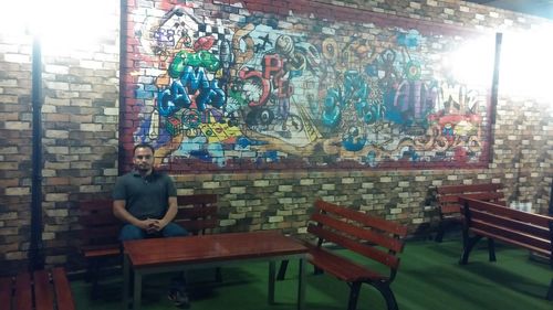 Man sitting on chair in building