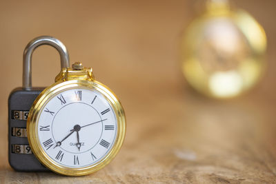 Close-up of pocket watch on table