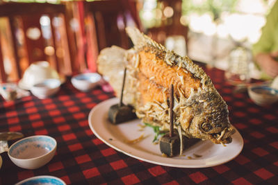 Close-up of fish served in plate on table