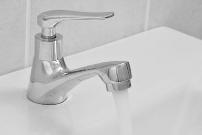 Close-up of faucet in bathroom