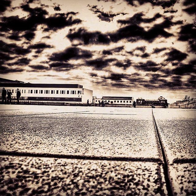 sky, cloud - sky, cloudy, overcast, built structure, cloud, weather, architecture, transportation, building exterior, road, street, storm cloud, outdoors, no people, dusk, surface level, day, dramatic sky, incidental people