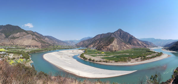 Panoramic view of mountain range against clear sky