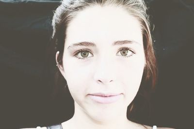 Close-up portrait of smiling young woman