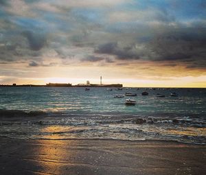 Scenic view of sea against cloudy sky