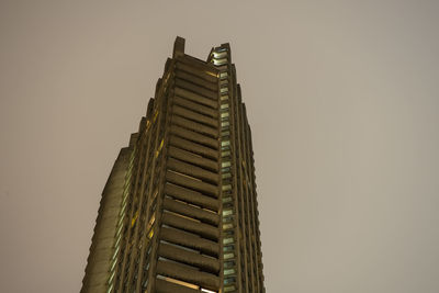 Low angle view of skyscraper against clear sky