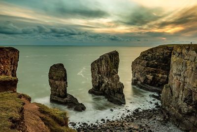 Scenic view of sea against sky at sunset