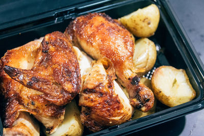 Close-up of grilled chicken and potatoes