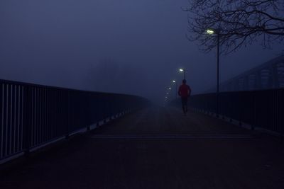 Man on road at night