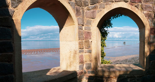 Sea seen through arch window