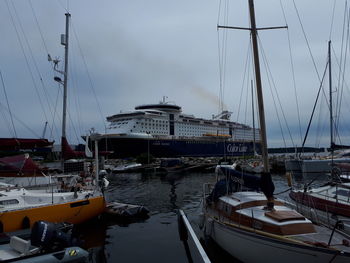 Boats moored at harbor