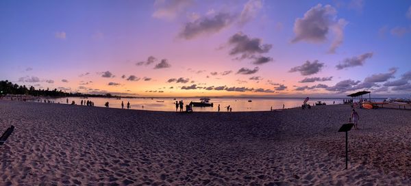 Scenic view of beach against sky during sunset