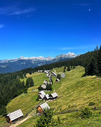 Scenic view of mountains against blue sky