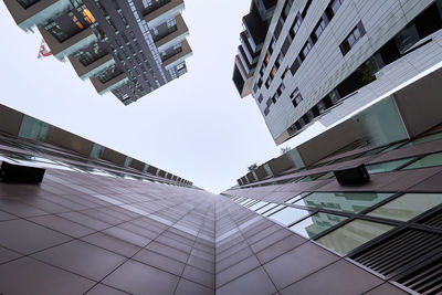 Low angle view of modern buildings against sky