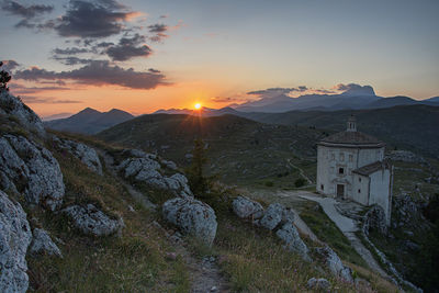 Scenic view of mountains against sky during sunset