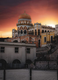 View of historic building against sky during sunset
