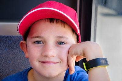 Close-up portrait of boy wearing hat