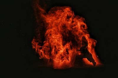 Close-up of bonfire against black background