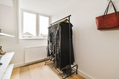 Clothes hanging by wall at home