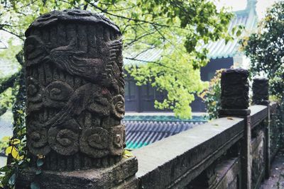 Close-up of statue against building