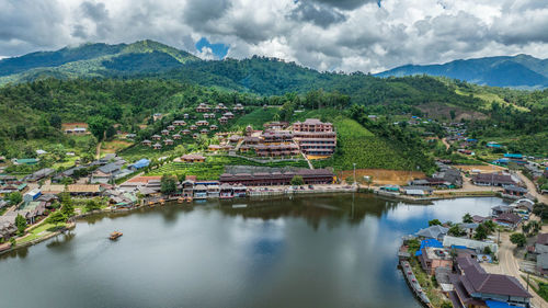 Scenic view of lake and mountains against sky